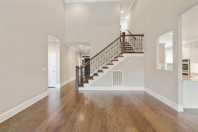 212 Lotus Ct, Hendersonville, TN 37075 - stairs featuring ornamental molding, a high ceiling, wood finished floors, baseboards, and recessed lighting