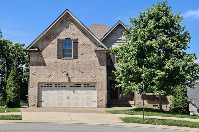 212 Lotus Ct, Hendersonville, TN 37075 - view of front of home with brick siding, driveway, and an attached garage