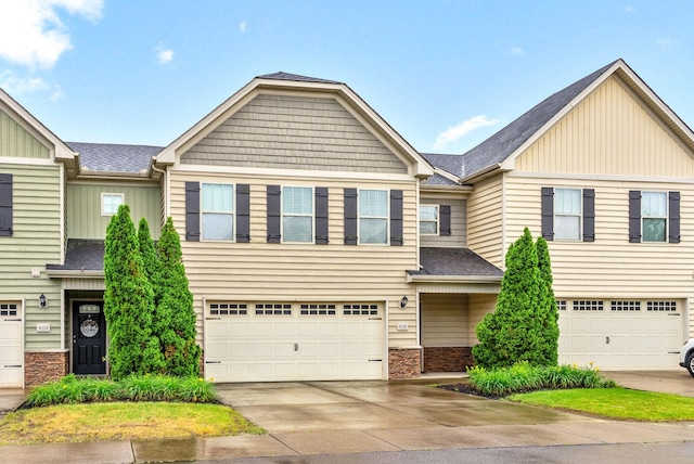 4115 Giacomo Dr, Murfreesboro, TN 37128 - view of property with board and batten siding, an attached garage, roof with shingles, concrete driveway, and stone siding
