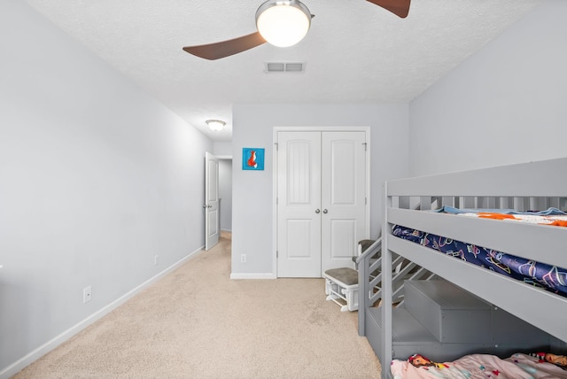 4115 Giacomo Dr, Murfreesboro, TN 37128 - carpeted bedroom with baseboards, a closet, a textured ceiling, and a ceiling fan