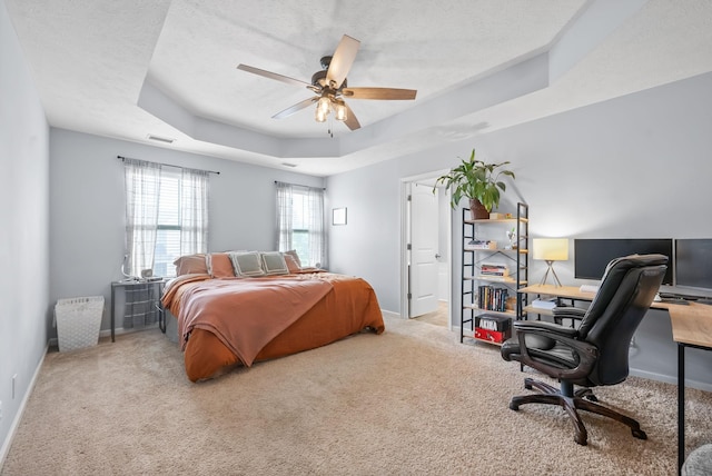 4115 Giacomo Dr, Murfreesboro, TN 37128 - carpeted bedroom featuring a tray ceiling, an office area, baseboards, a textured ceiling, and a ceiling fan