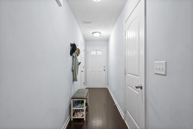 4115 Giacomo Dr, Murfreesboro, TN 37128 - doorway featuring a textured ceiling, baseboards, and dark wood-style flooring
