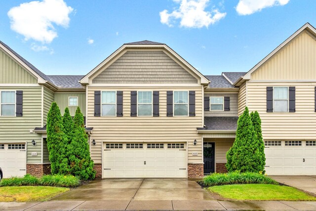 4115 Giacomo Dr, Murfreesboro, TN 37128 - view of property featuring a garage, driveway, roof with shingles, and board and batten siding