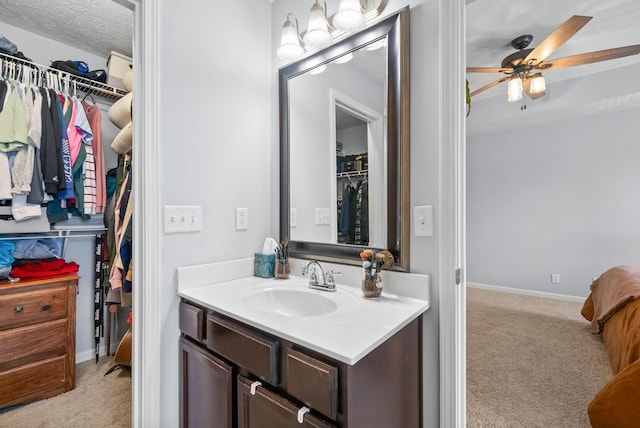 4115 Giacomo Dr, Murfreesboro, TN 37128 - bathroom featuring vanity, a walk in closet, baseboards, and a ceiling fan