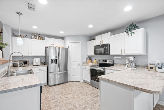 4115 Giacomo Dr, Murfreesboro, TN 37128 - kitchen featuring appliances with stainless steel finishes, a peninsula, a sink, light countertops, and white cabinets