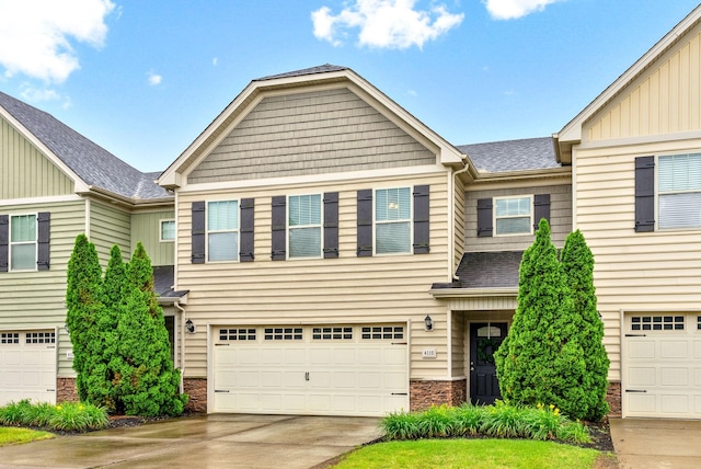 4115 Giacomo Dr, Murfreesboro, TN 37128 - view of front of home with stone siding, driveway, an attached garage, and roof with shingles