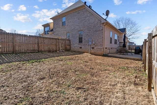 3699 Prestwicke Pl, Adams, TN 37010 - rear view of house with crawl space, a patio, brick siding, and a fenced backyard