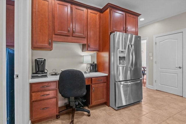 3699 Prestwicke Pl, Adams, TN 37010 - kitchen featuring stainless steel fridge, light countertops, light tile patterned flooring, recessed lighting, and brown cabinets