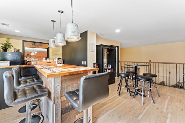 860 Old Woodbury Pike, Readyville, TN 37149 - bar area with light wood finished floors, hanging light fixtures, and recessed lighting
