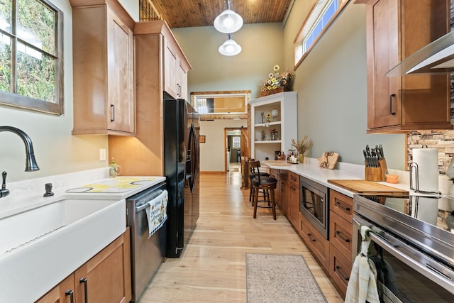 860 Old Woodbury Pike, Readyville, TN 37149 - kitchen featuring appliances with stainless steel finishes, a sink, wall chimney range hood, wood ceiling, and light countertops