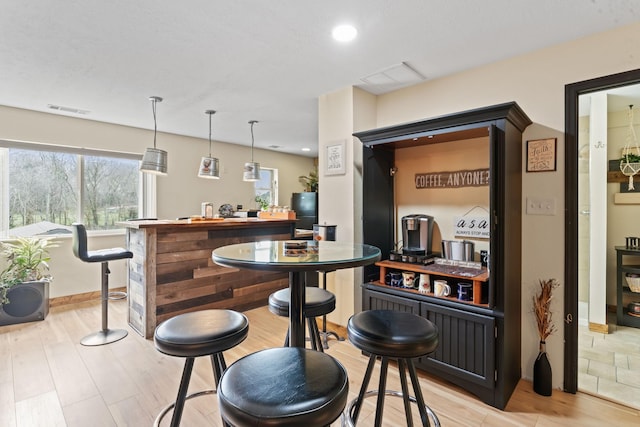 860 Old Woodbury Pike, Readyville, TN 37149 - bar with light wood finished floors, baseboards, decorative light fixtures, and recessed lighting