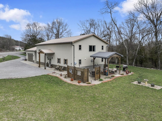 860 Old Woodbury Pike, Readyville, TN 37149 - rear view of property with a lawn, a patio, gravel driveway, an outdoor hangout area, and metal roof