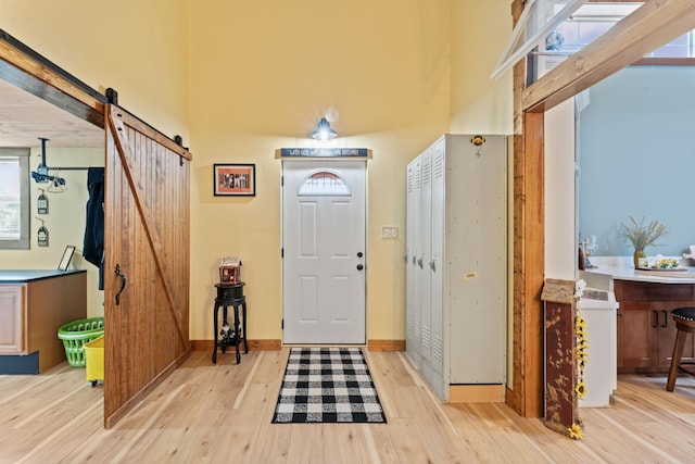 860 Old Woodbury Pike, Readyville, TN 37149 - entrance foyer with a barn door, wood finished floors, and baseboards