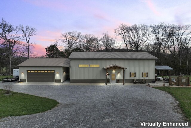 860 Old Woodbury Pike, Readyville, TN 37149 - view of front of property with driveway, metal roof, and a garage
