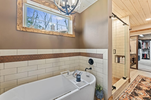 860 Old Woodbury Pike, Readyville, TN 37149 - bathroom with a stall shower, a chandelier, a freestanding tub, and a spacious closet