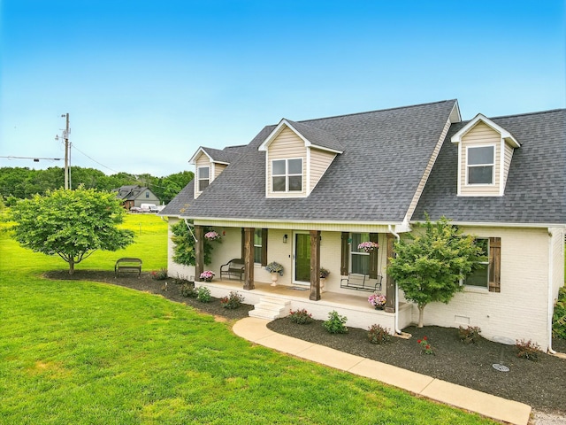 1864 Sawgrass Ln, Chapel Hill, TN 37034 - cape cod house featuring brick siding, a porch, roof with shingles, and a front yard