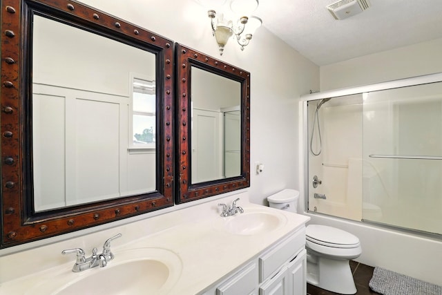 1864 Sawgrass Ln, Chapel Hill, TN 37034 - full bathroom featuring toilet, double vanity, shower / bath combination with glass door, and tile patterned floors