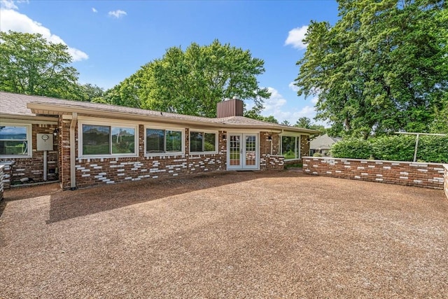 183 Prairie Plains Rd, Hillsboro, TN 37342 - back of house with french doors, a chimney, and brick siding