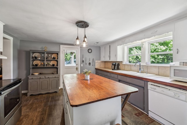 123 Columbia Ave, Centerville, TN 37033 - kitchen with white appliances, wood counters, a sink, white cabinets, and a center island