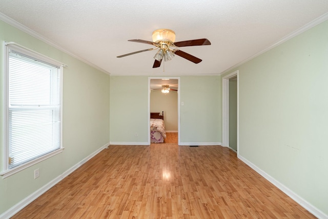 942 Youngs Ln, Nashville, TN 37207 - spare room featuring ceiling fan, light wood-style flooring, crown molding, and baseboards