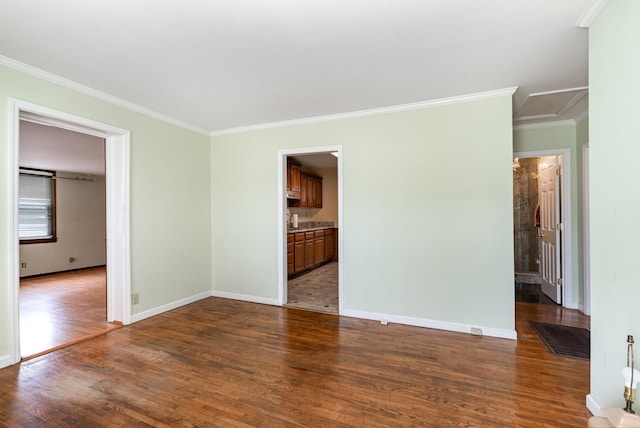 942 Youngs Ln, Nashville, TN 37207 - empty room featuring dark wood-style flooring, crown molding, and baseboards