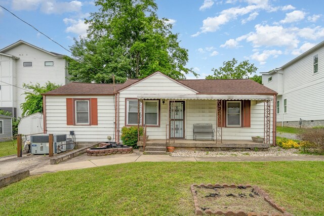 942 Youngs Ln, Nashville, TN 37207 - view of front of house with covered porch, central AC, a shingled roof, and a patio area