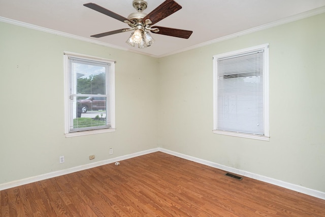 942 Youngs Ln, Nashville, TN 37207 - empty room with wood finished floors, crown molding, baseboards, and a ceiling fan