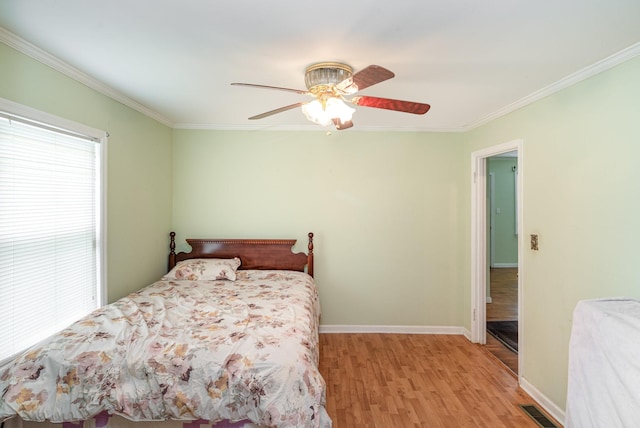 942 Youngs Ln, Nashville, TN 37207 - bedroom featuring ornamental molding, light wood-style flooring, baseboards, and ceiling fan