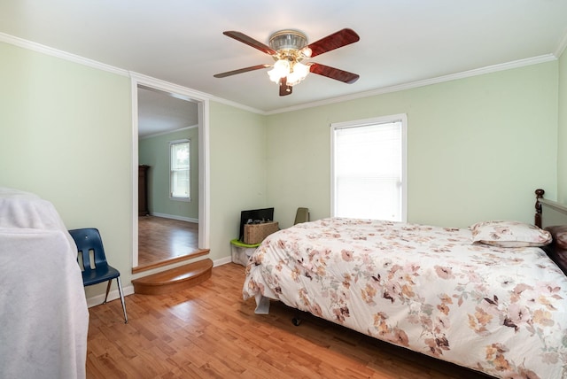 942 Youngs Ln, Nashville, TN 37207 - bedroom with ornamental molding, light wood-style flooring, baseboards, and a ceiling fan
