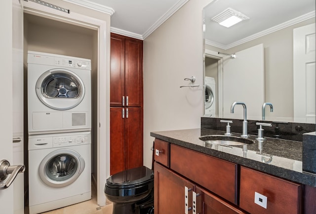4215 Harding Pike Unit 601, Nashville, TN 37205 - washroom with stacked washer / drying machine and ornamental molding