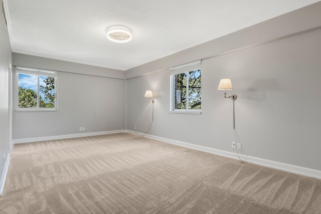 4215 Harding Pike Unit 601, Nashville, TN 37205 - spare room featuring carpet floors, baseboards, and healthy amount of natural light