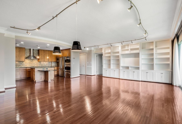 4215 Harding Pike Unit 601, Nashville, TN 37205 - unfurnished living room featuring track lighting, dark wood-style flooring, crown molding, and baseboards