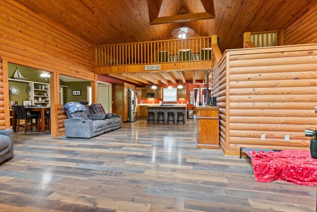 4357 Old Blacktop Rd, Mc Ewen, TN 37101 - living room featuring wood finished floors, high vaulted ceiling, rustic walls, and wooden ceiling