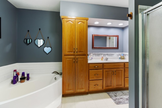 4357 Old Blacktop Rd, Mc Ewen, TN 37101 - bathroom with vanity, a garden tub, and a shower stall