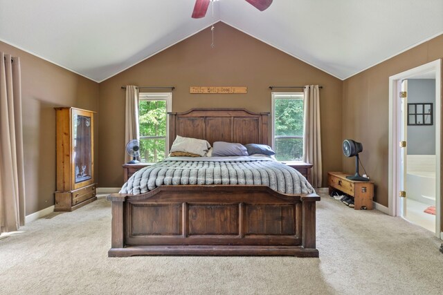 4357 Old Blacktop Rd, Mc Ewen, TN 37101 - bedroom with light carpet, baseboards, vaulted ceiling, ensuite bathroom, and ceiling fan