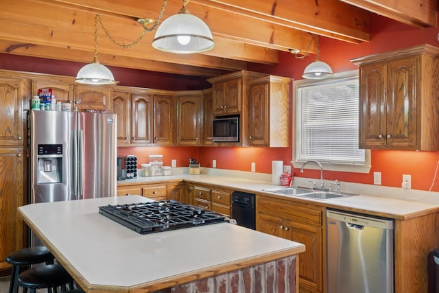 4357 Old Blacktop Rd, Mc Ewen, TN 37101 - kitchen featuring appliances with stainless steel finishes, a sink, beamed ceiling, a kitchen island, and light countertops
