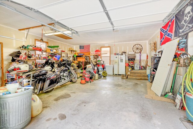 4357 Old Blacktop Rd, Mc Ewen, TN 37101 - garage featuring white fridge with ice dispenser