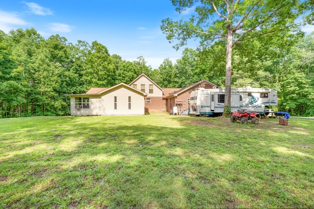 4357 Old Blacktop Rd, Mc Ewen, TN 37101 - rear view of house with a lawn
