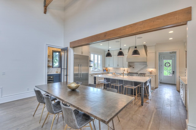 1021 Julian Way, Murfreesboro, TN 37128 - dining room with light wood-type flooring, beamed ceiling, recessed lighting, and wine cooler