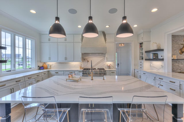 1021 Julian Way, Murfreesboro, TN 37128 - kitchen with wall chimney range hood, open shelves, backsplash, recessed lighting, and a large island