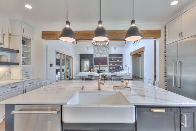 1021 Julian Way, Murfreesboro, TN 37128 - kitchen featuring open floor plan, a sink, appliances with stainless steel finishes, light stone counters, and recessed lighting