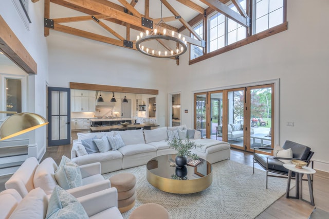 1021 Julian Way, Murfreesboro, TN 37128 - living area featuring high vaulted ceiling, a chandelier, wood finished floors, beam ceiling, and french doors