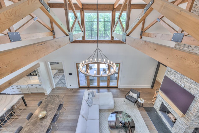1021 Julian Way, Murfreesboro, TN 37128 - living room featuring hardwood / wood-style floors, baseboards, a chandelier, beamed ceiling, and high vaulted ceiling