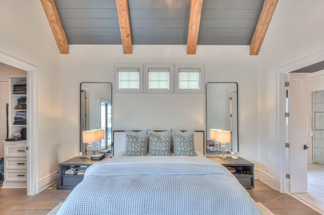 1021 Julian Way, Murfreesboro, TN 37128 - bedroom featuring wood finished floors, wooden ceiling, a walk in closet, and baseboards