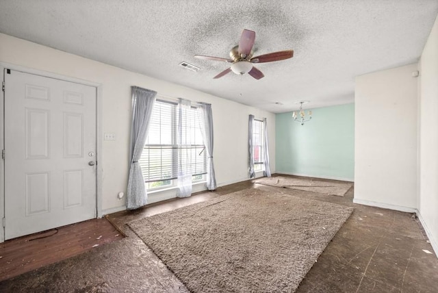 141 Bumpus Mill Rd, Oak Grove, KY 42262 - empty room with a chandelier, ceiling fan, a textured ceiling, and baseboards