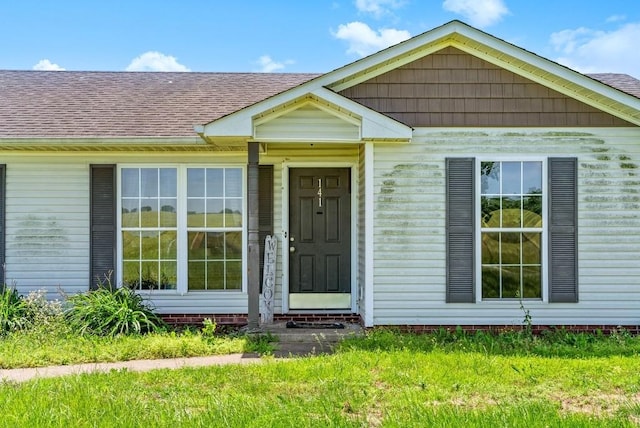141 Bumpus Mill Rd, Oak Grove, KY 42262 - doorway to property with roof with shingles and a yard
