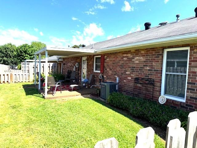 1130 Horse Mountain Rd Unit E, Shelbyville, TN 37160 - back of house with cooling unit, a patio area, and brick siding