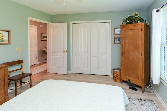1130 Horse Mountain Rd Unit E, Shelbyville, TN 37160 - bedroom featuring light wood-style floors, a closet, baseboards, and ceiling fan