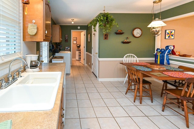 1130 Horse Mountain Rd Unit E, Shelbyville, TN 37160 - kitchen with a sink, ornamental molding, light tile patterned floors, light countertops, and washer / dryer
