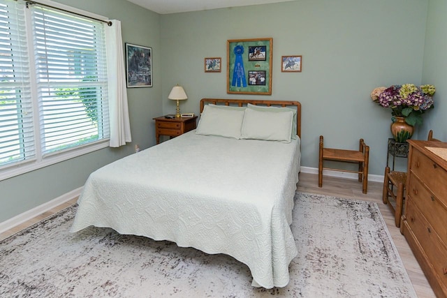 1130 Horse Mountain Rd Unit E, Shelbyville, TN 37160 - bedroom featuring light wood-style floors and baseboards